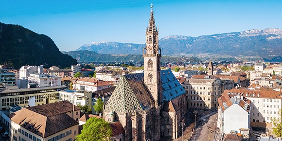 Picture of the panorama of the city Bolzano in Italy with Buildings and Mountains.